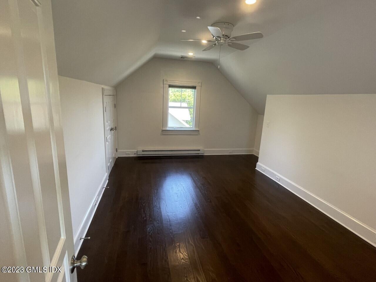 37 Orchard Street, Unit B Cos Cob, CT 06807 - Photo 10 of 15 an empty room with wooden floor and windows