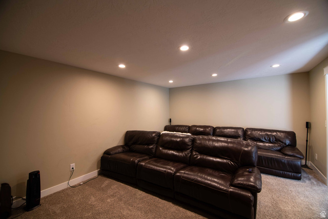 646 East 1400th Street North Mapleton, UT 84664 - Photo 43 of 78 Recessed ceiling lighting illuminating a spacious room with neutral wall tones and a plush carpeted floor