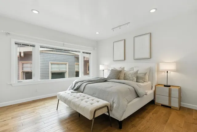 a bedroom with bed and a window