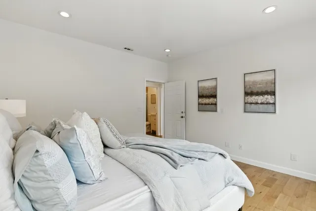 a bedroom with a bed and a dresser