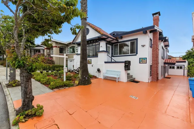 front view of a house with a large window