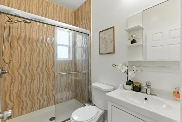 a bedroom with furniture and a window