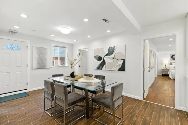 an aerial view of residential houses with city view