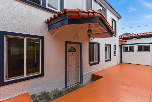 a room with furniture and large windows