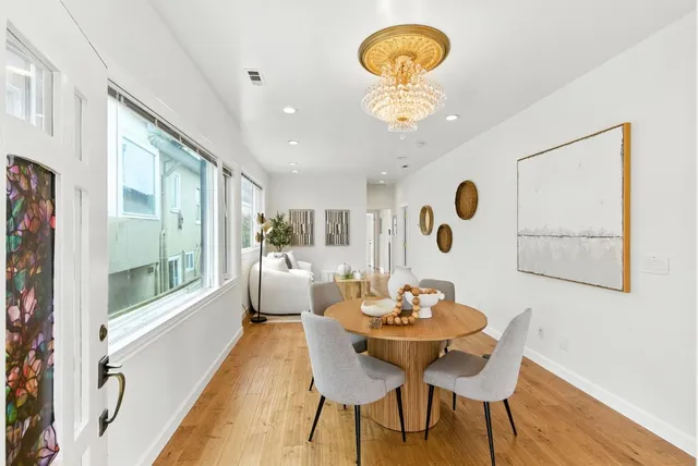 a bedroom with a bed and glass window