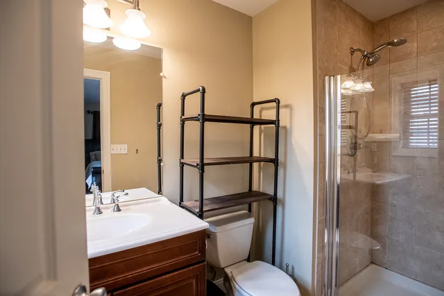 a bedroom with a bed and a dresser in it