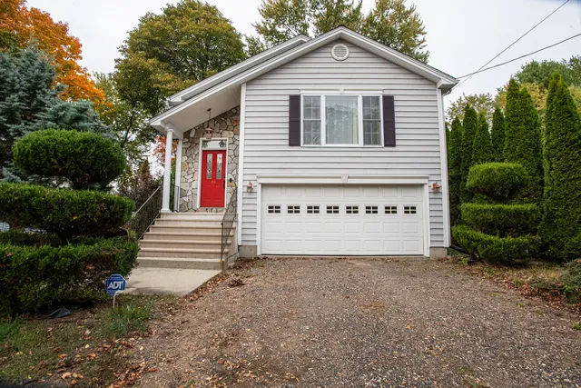 a view of a house with a yard and plants