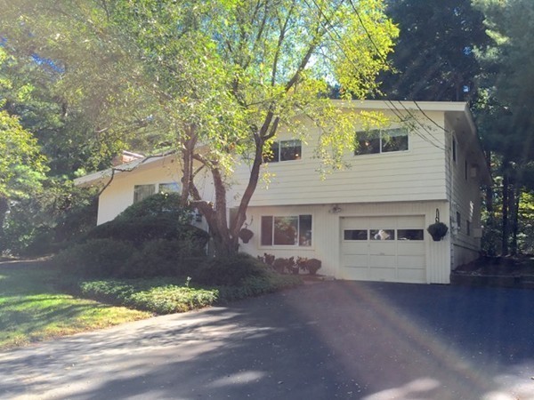 27 Joyce Road Framingham, MA 01701 - Photo 3 of 23 a view of a house with a yard and a garage