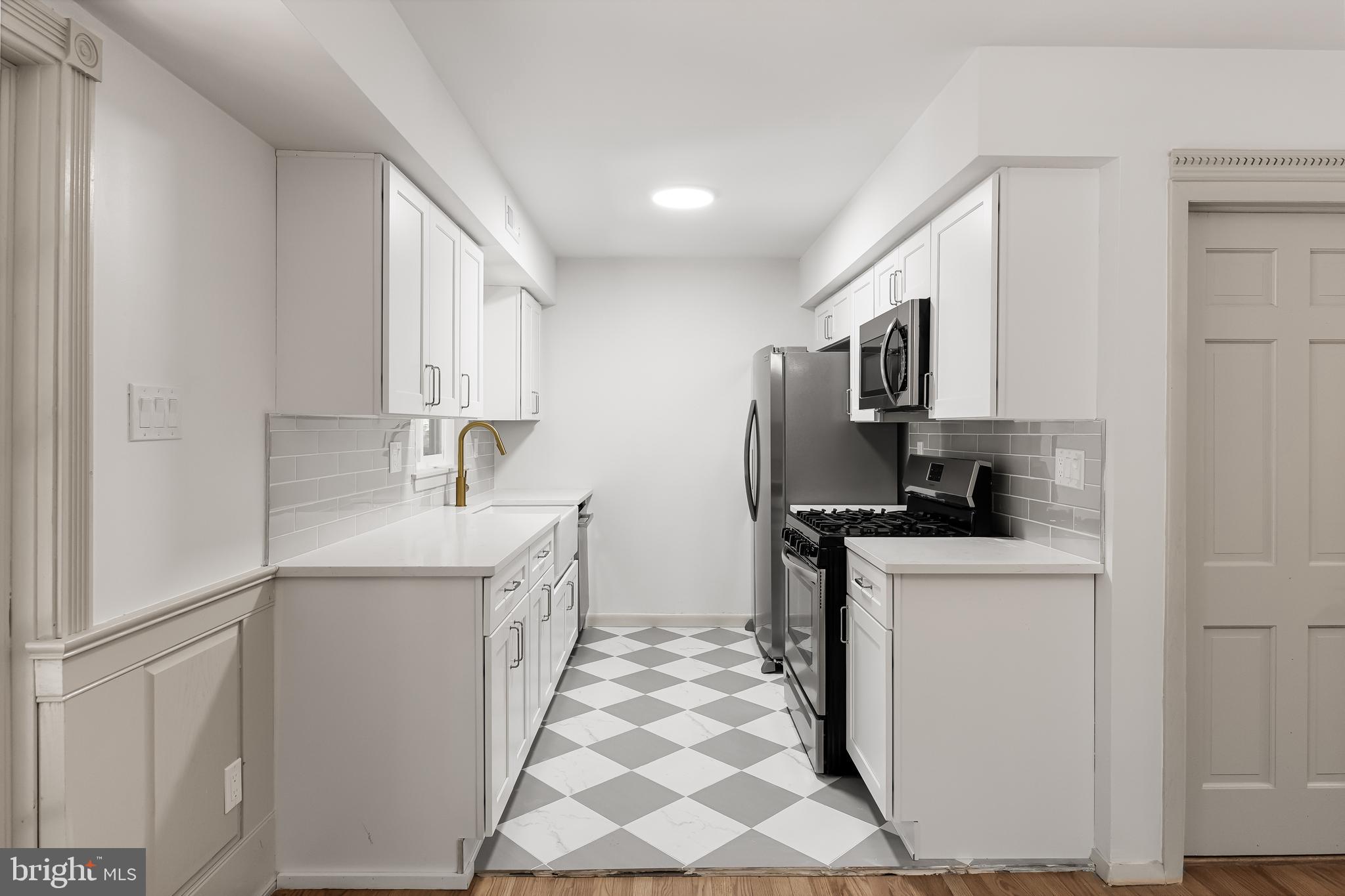42 Trowbridge Lane, Unit DD Clementon, NJ 08021 - Photo 1 of 28 a kitchen with stainless steel appliances a sink stove refrigerator and cabinets