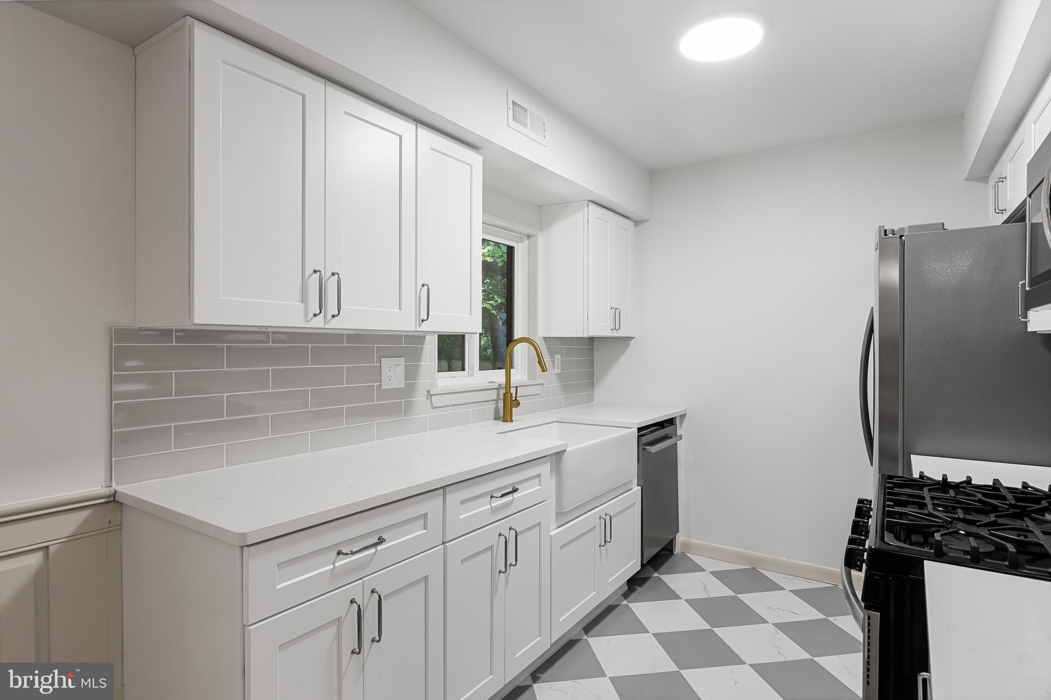 42 Trowbridge Lane, Unit DD Clementon, NJ 08021 - Photo 2 of 28 a kitchen with a sink and cabinets