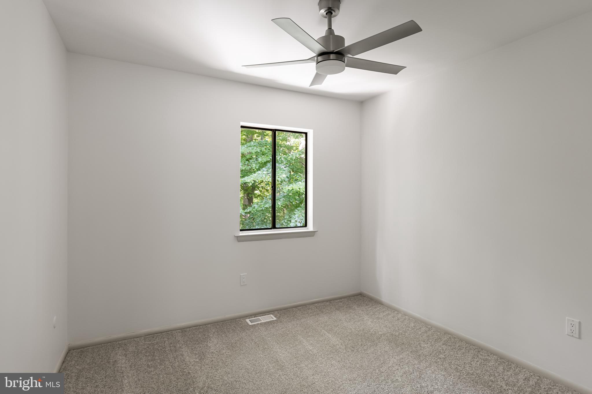 42 Trowbridge Lane, Unit DD Clementon, NJ 08021 - Photo 23 of 28 an empty room with a window and a fan