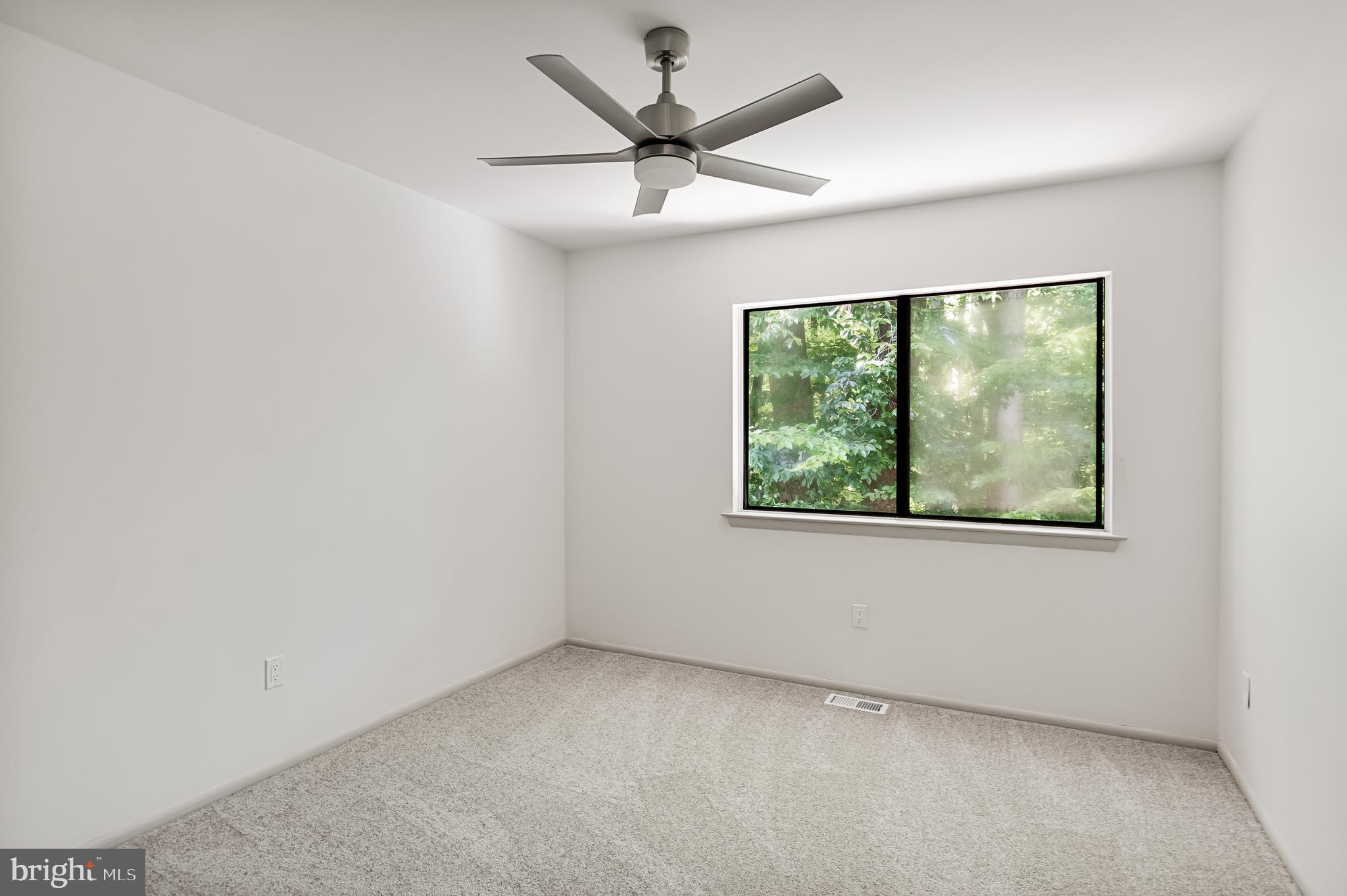 42 Trowbridge Lane, Unit DD Clementon, NJ 08021 - Photo 24 of 28 an empty room with a window and a ceiling fan