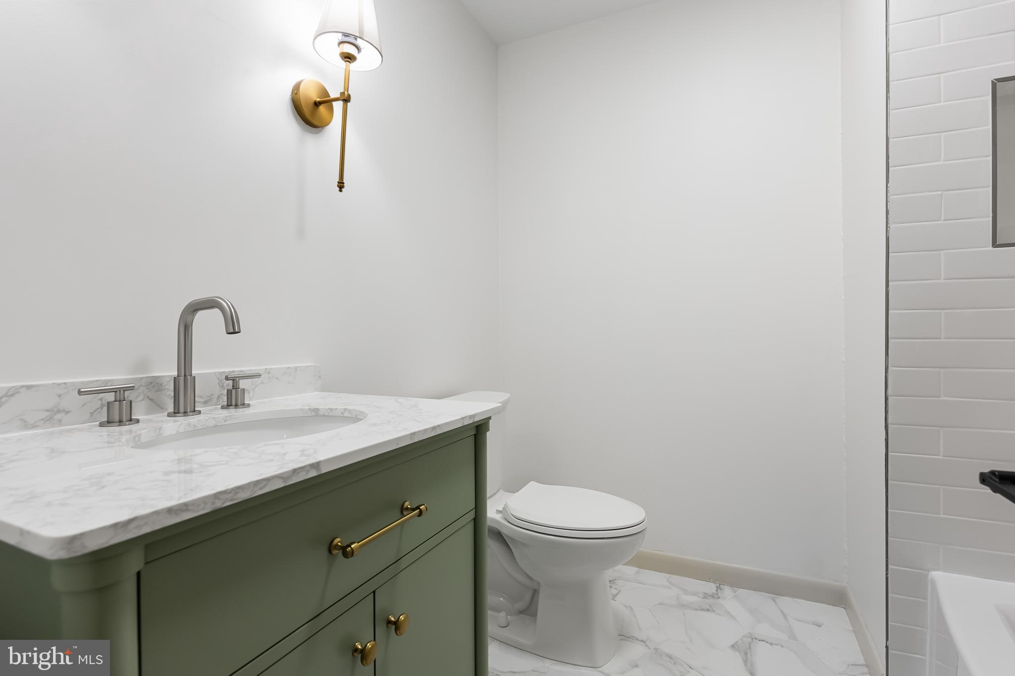 42 Trowbridge Lane, Unit DD Clementon, NJ 08021 - Photo 25 of 28 a bathroom with a sink toilet and vanity