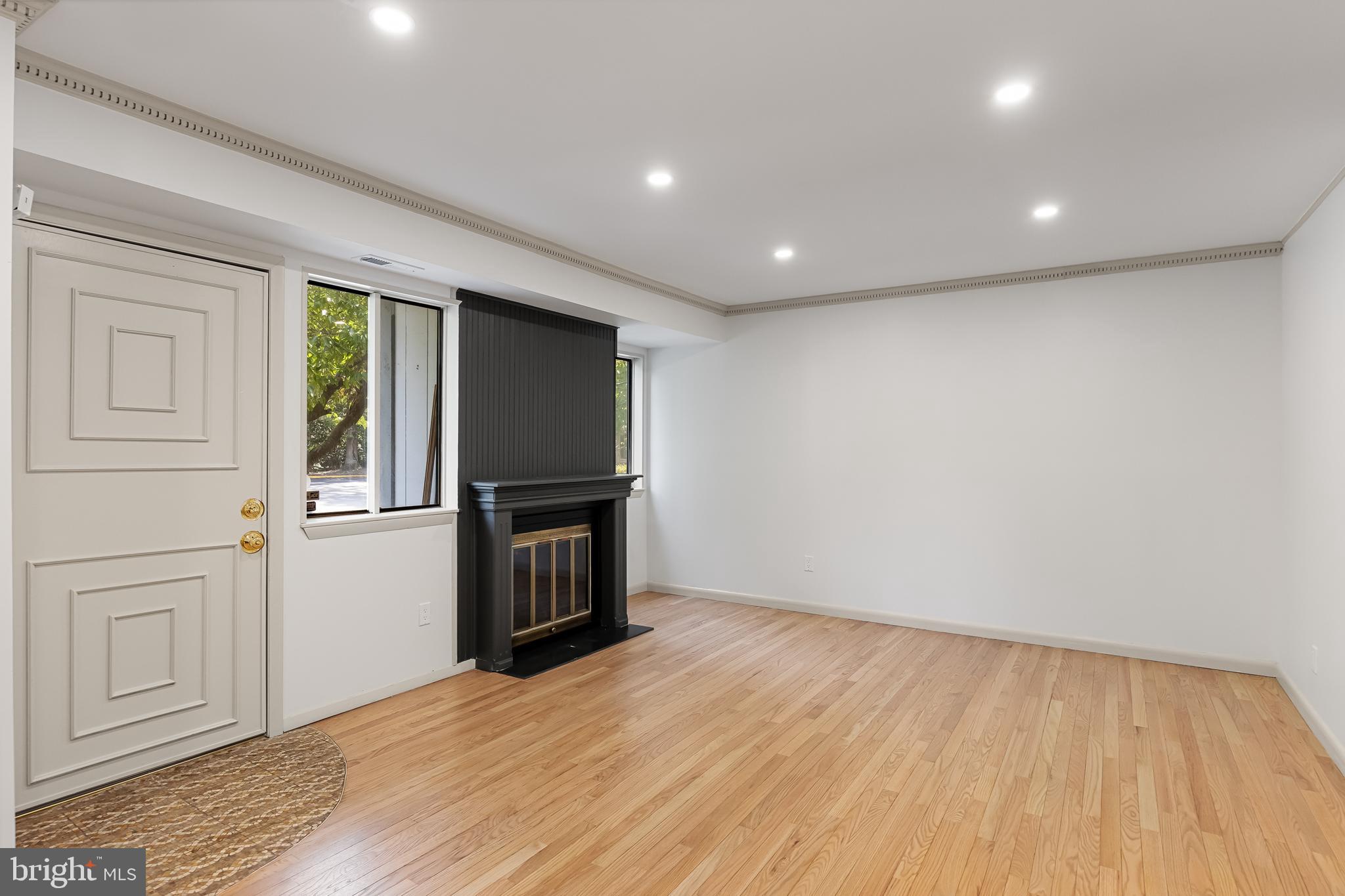 42 Trowbridge Lane, Unit DD Clementon, NJ 08021 - Photo 7 of 28 a view of empty room with wooden floor and fan