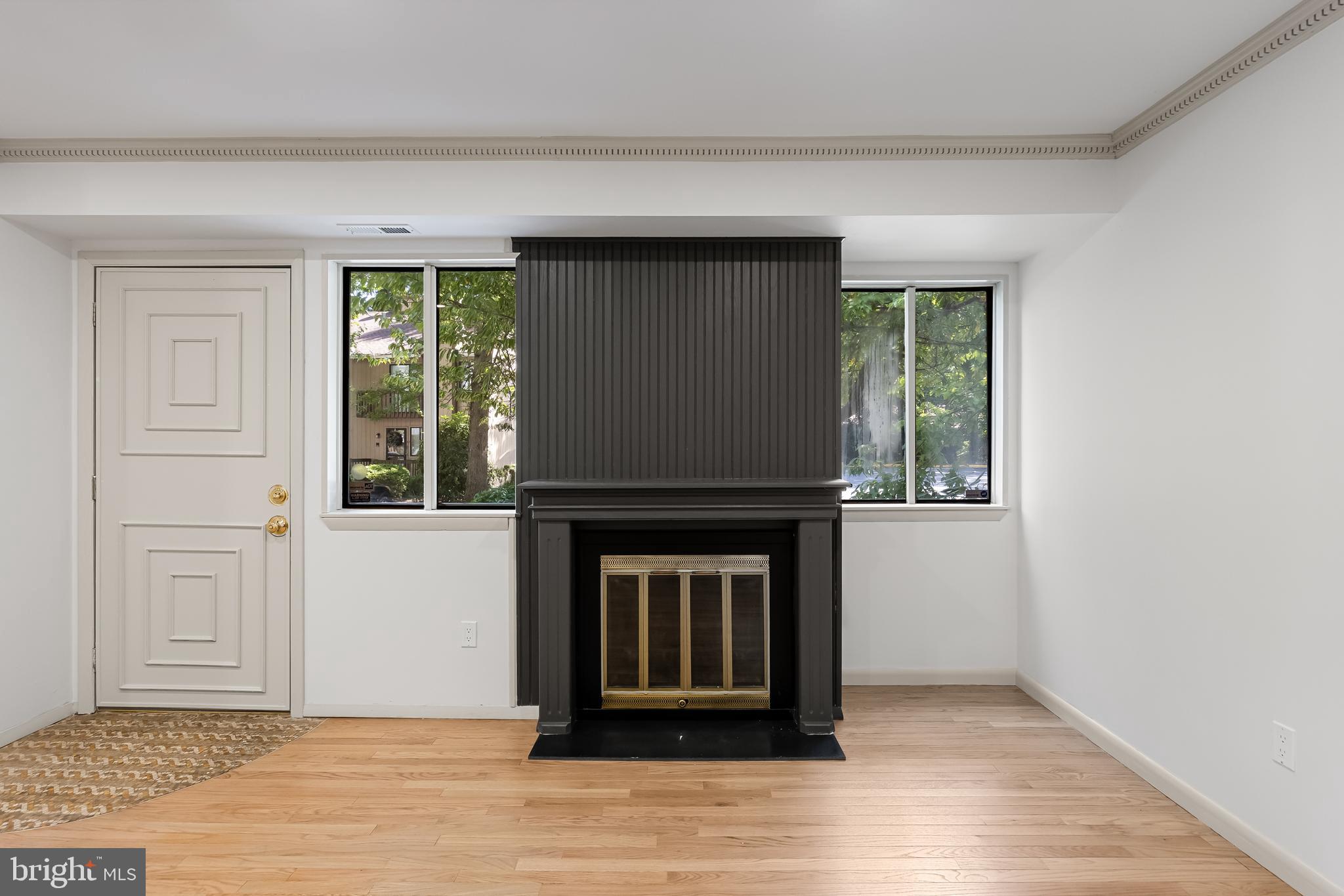 42 Trowbridge Lane, Unit DD Clementon, NJ 08021 - Photo 9 of 28 a living room with a fireplace and a window