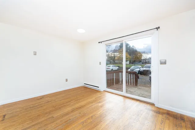 an empty room with sliding glass door