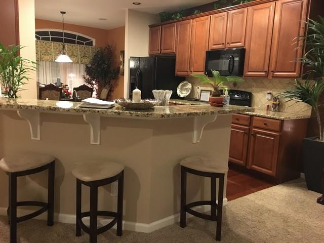 1001 Queens Place Spring Hill, TN 37174 - Photo 13 of 18 Kitchen with Breakfast Bar