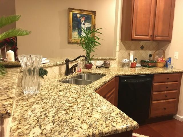 1001 Queens Place Spring Hill, TN 37174 - Photo 7 of 18 Kitchen with granite counter tops and hardwood floors
