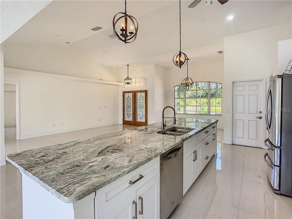 7531 Perennial Road North Port, FL 34291 - Photo 13 of 48 Kitchen with eat in bar area