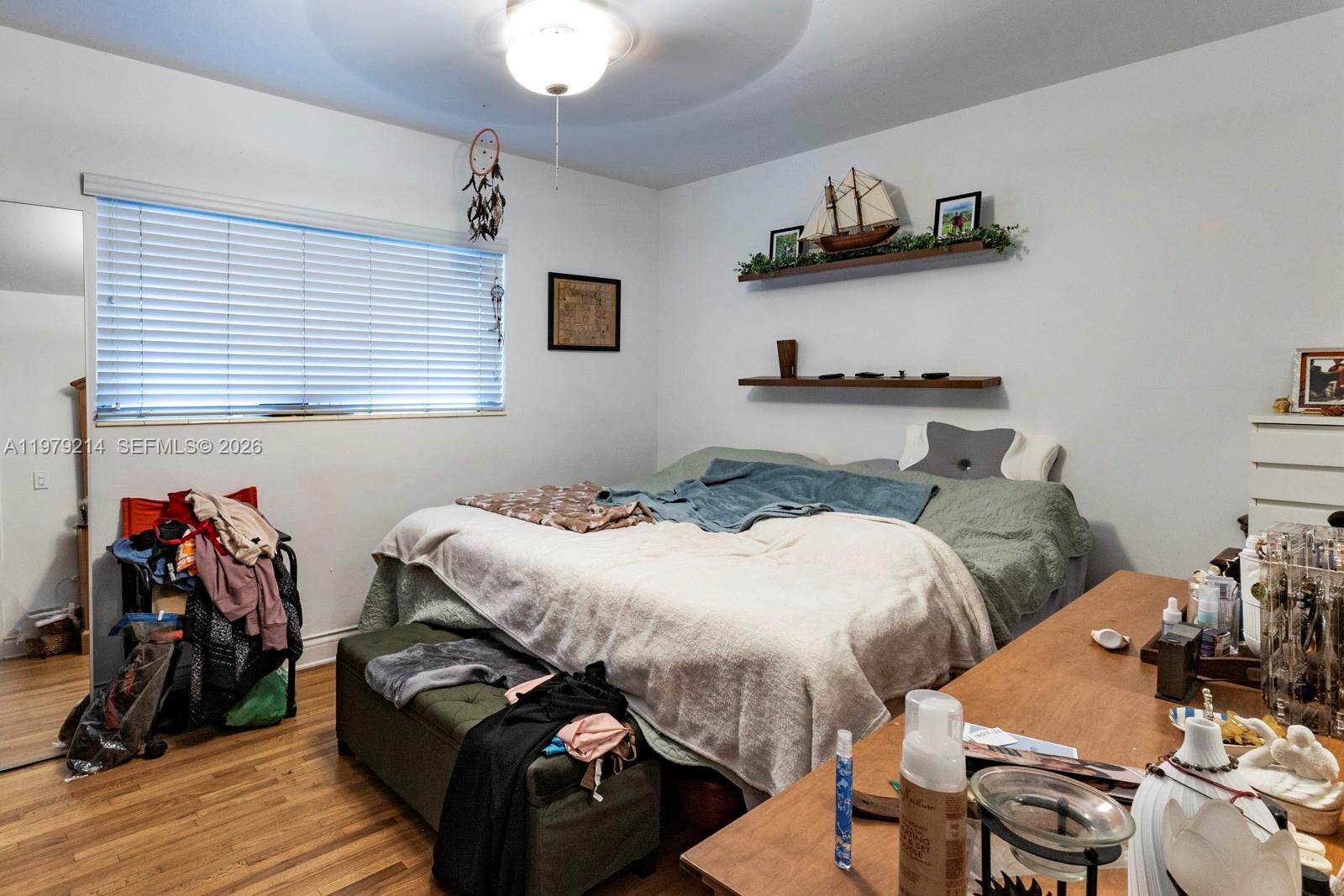 2710 Southwest 28th Court Miami, FL 33133 - Photo 12 of 19 a bedroom with bed and a wooden floor