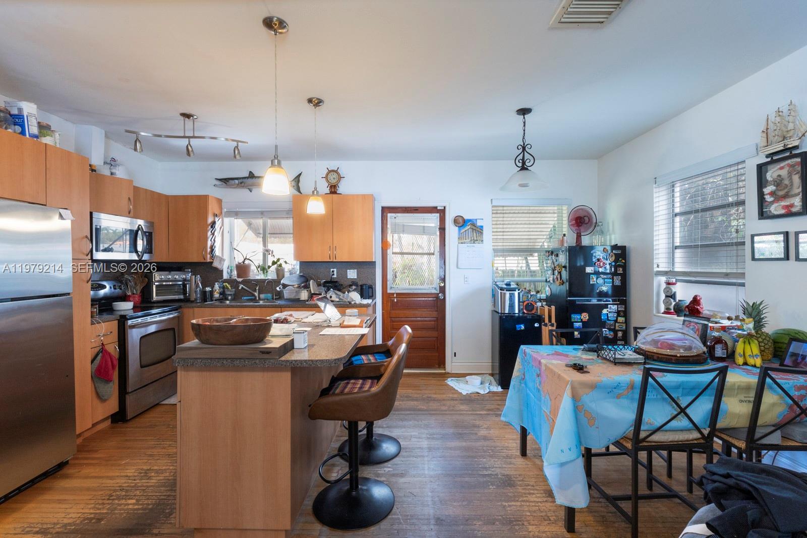 2710 Southwest 28th Court Miami, FL 33133 - Photo 8 of 19 a view of a dining room with furniture window and outside view