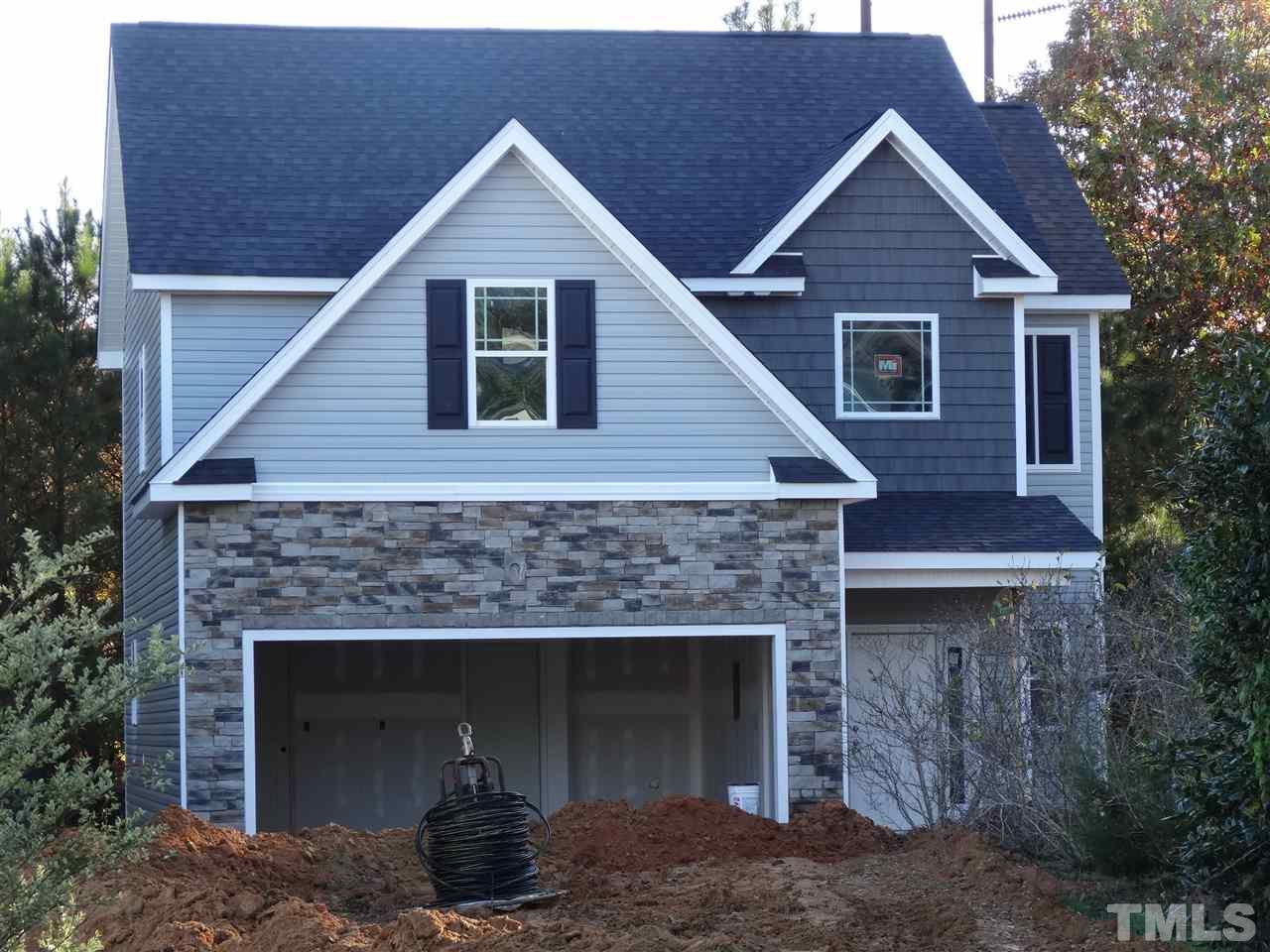 6212 Quitman Trail Raleigh, NC 27610 - Photo 1 of 20 a front view of a house with a yard