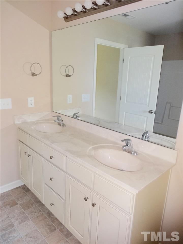 6212 Quitman Trail Raleigh, NC 27610 - Photo 18 of 20 a bathroom with a sink and a mirror