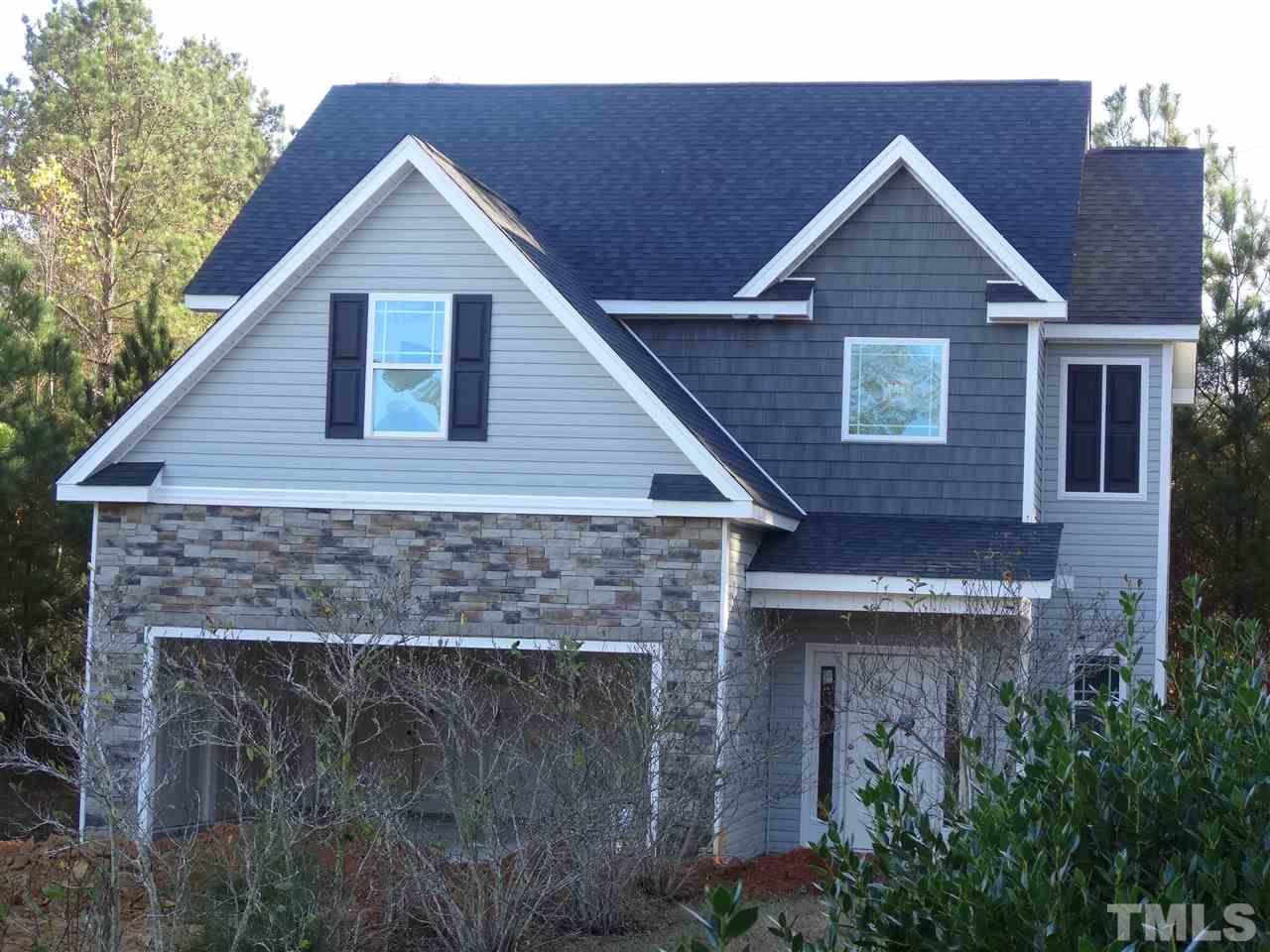 6212 Quitman Trail Raleigh, NC 27610 - Photo 7 of 20 a front view of a house with plants