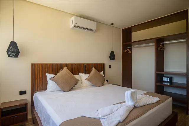 a bedroom with a bed and cabinets