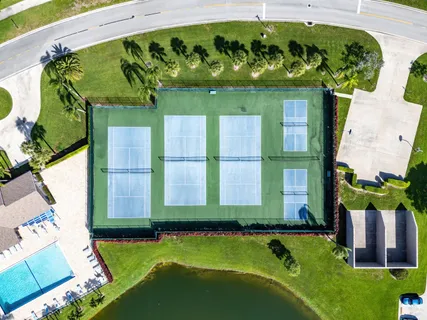 a view of a swimming pool with a yard
