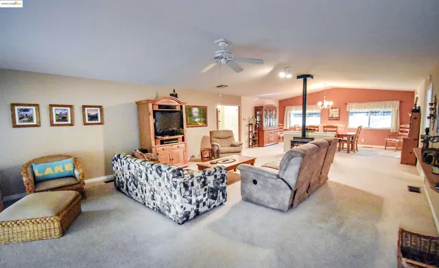 a living room with furniture rug and window