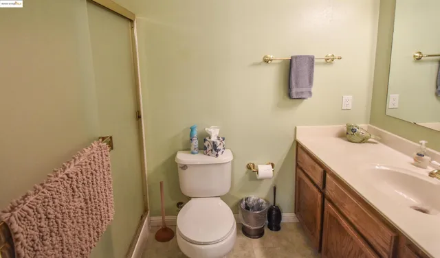a bathroom with a sink toilet and vanity