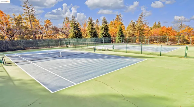 a view of an outdoor space and tennis court