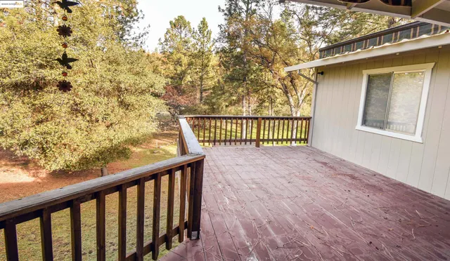 a view of balcony with wooden floor
