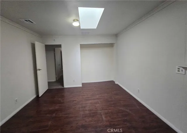 wooden floor in a hall with an entryway