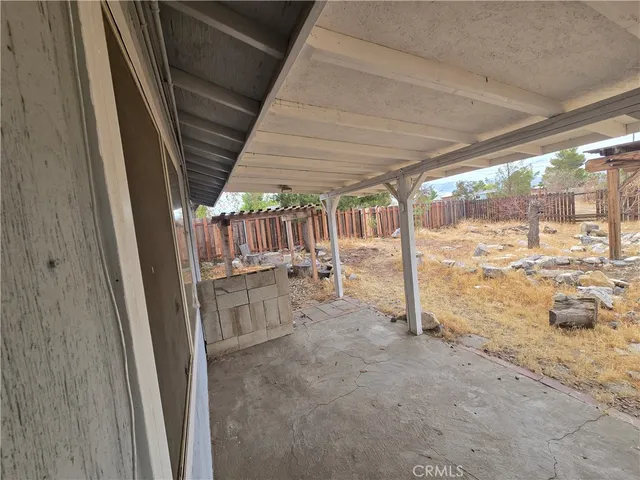 a view of porch with green space