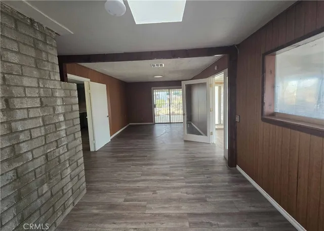 a view of hallway with wooden floor
