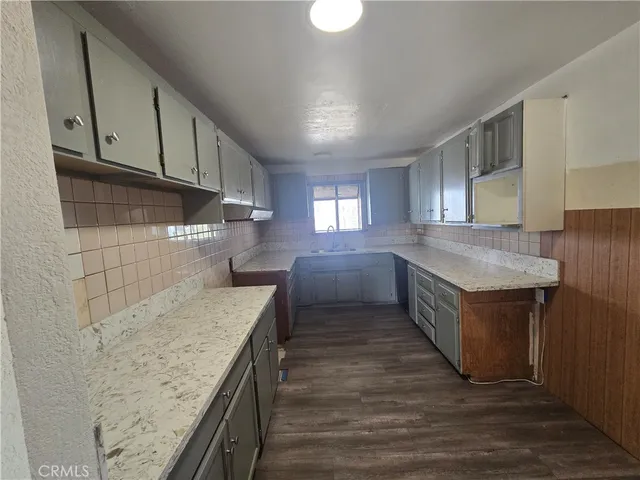 a kitchen with a stove and a sink