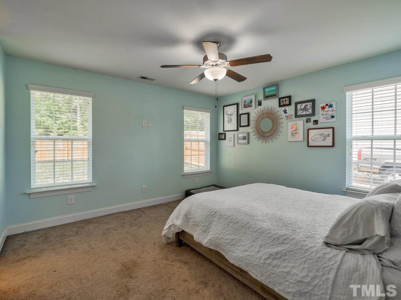 206 Orkney Road Stem, NC 27581 - Photo 14 of 30 a bedroom with a bed and window