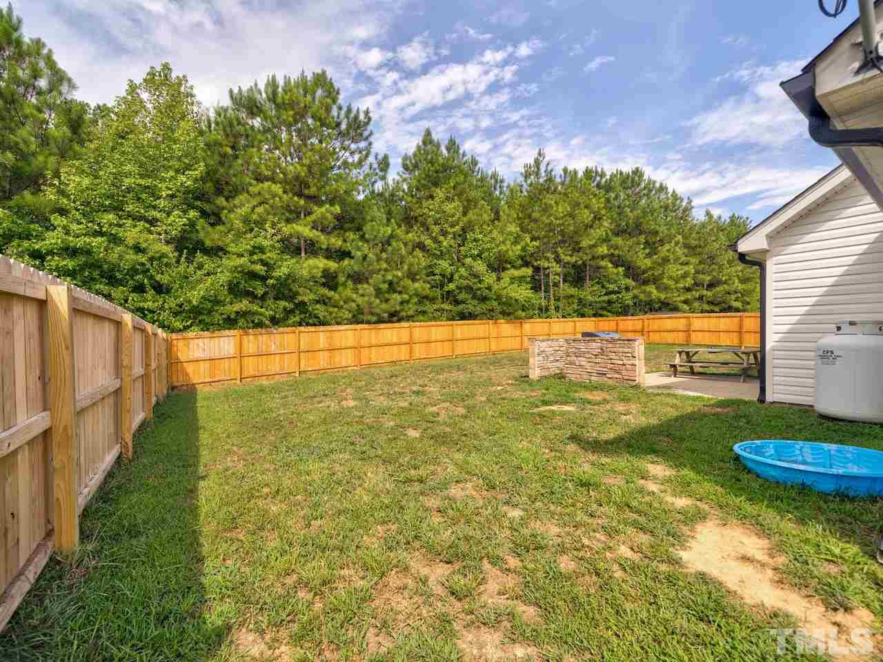 206 Orkney Road Stem, NC 27581 - Photo 22 of 30 a view of an outdoor space and a yard