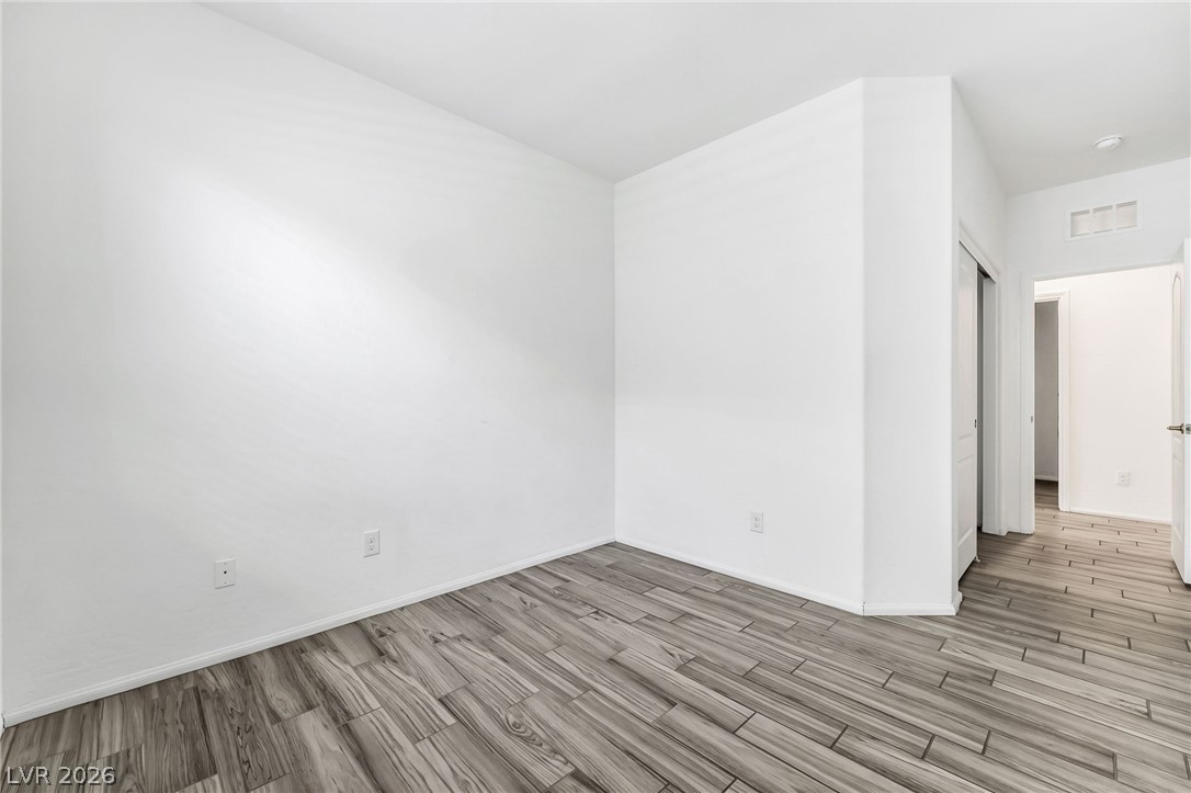 6245 Andover Wood Road Las Vegas, NV 89113 - Photo 24 of 37 Neutrally toned plank flooring extends throughout this versatile, well-proportioned interior space.