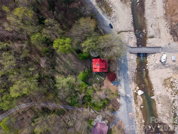 a view of a wooden house with a yard
