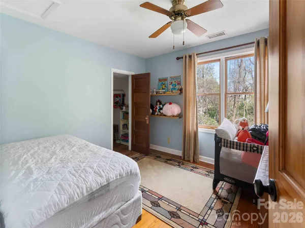 a bed room with a bed and a window