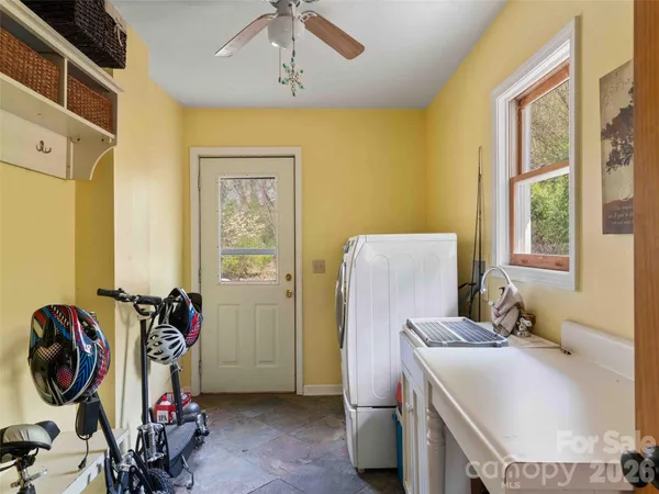 a bedroom with bed and a window