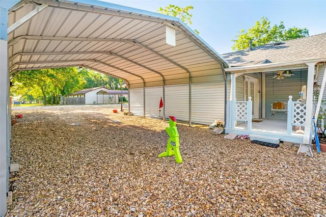 an outdoor space with seating area and barbeque oven