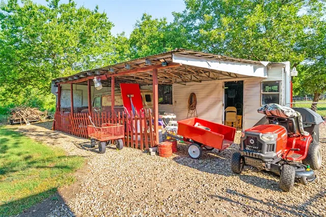 a view of a backyard with a patio