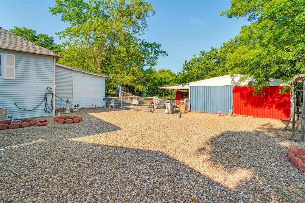 602 North Denison Street Bells, TX 75414 - Photo 14 of 16 a view of a backyard with a patio