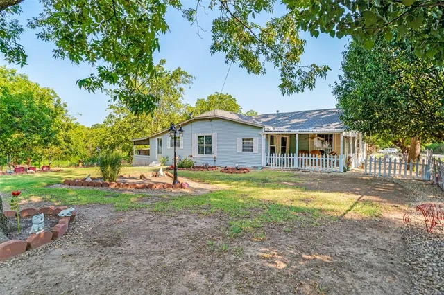 a view of a patio with table and chairs