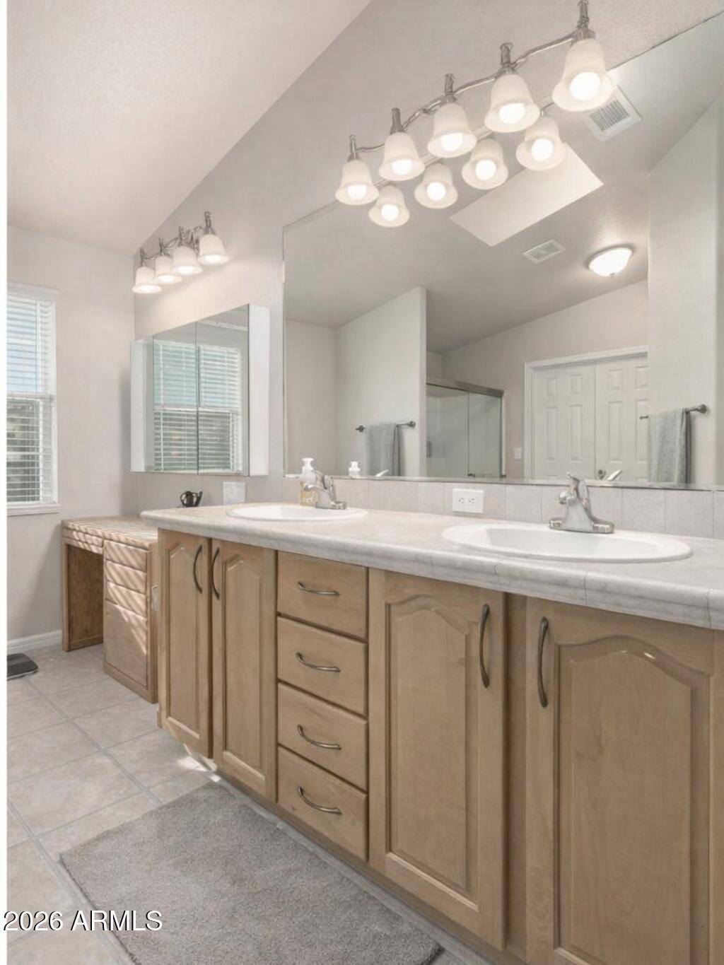 3301 South Goldfield Road, Unit 4086 Apache Junction, AZ 85119 - Photo 10 of 41 a bathroom with a sink vanity and a mirror