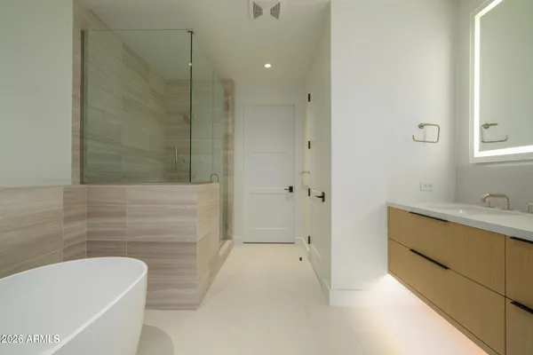 a bathroom with a sink and mirror